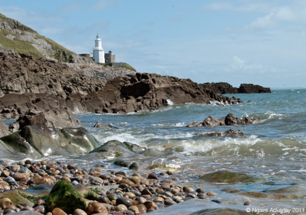 Beach and Lighthouse at beach in the Mumbles, Gower Peninsula, Wales